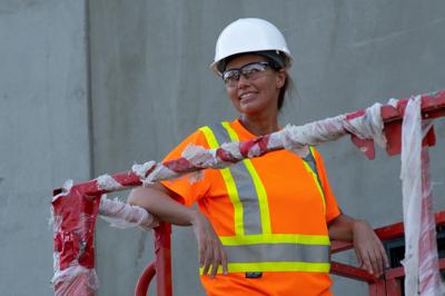 Worker wearing cooling gear and high-visibility apparel in hot weather conditions